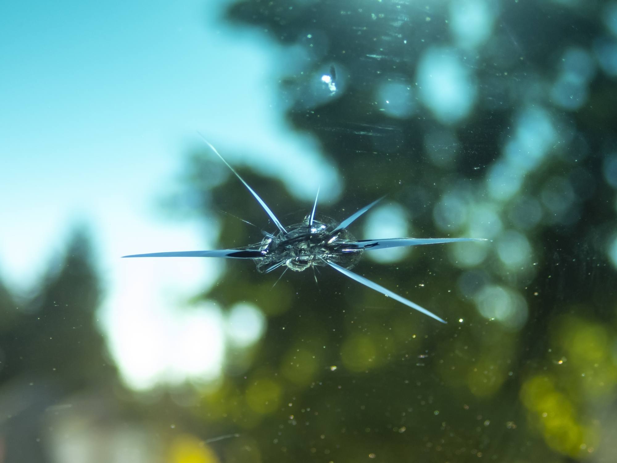 Car windshield with a small rock chip
